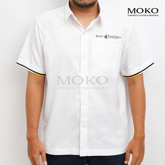 Man wearing a white short-sleeved Bank Kuningan corporate uniform shirt with yellow and black trim.